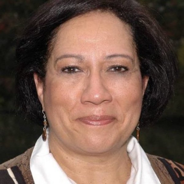 Close-up portrait of internationally acclaimed storyteller Ilene Evans smiling gently